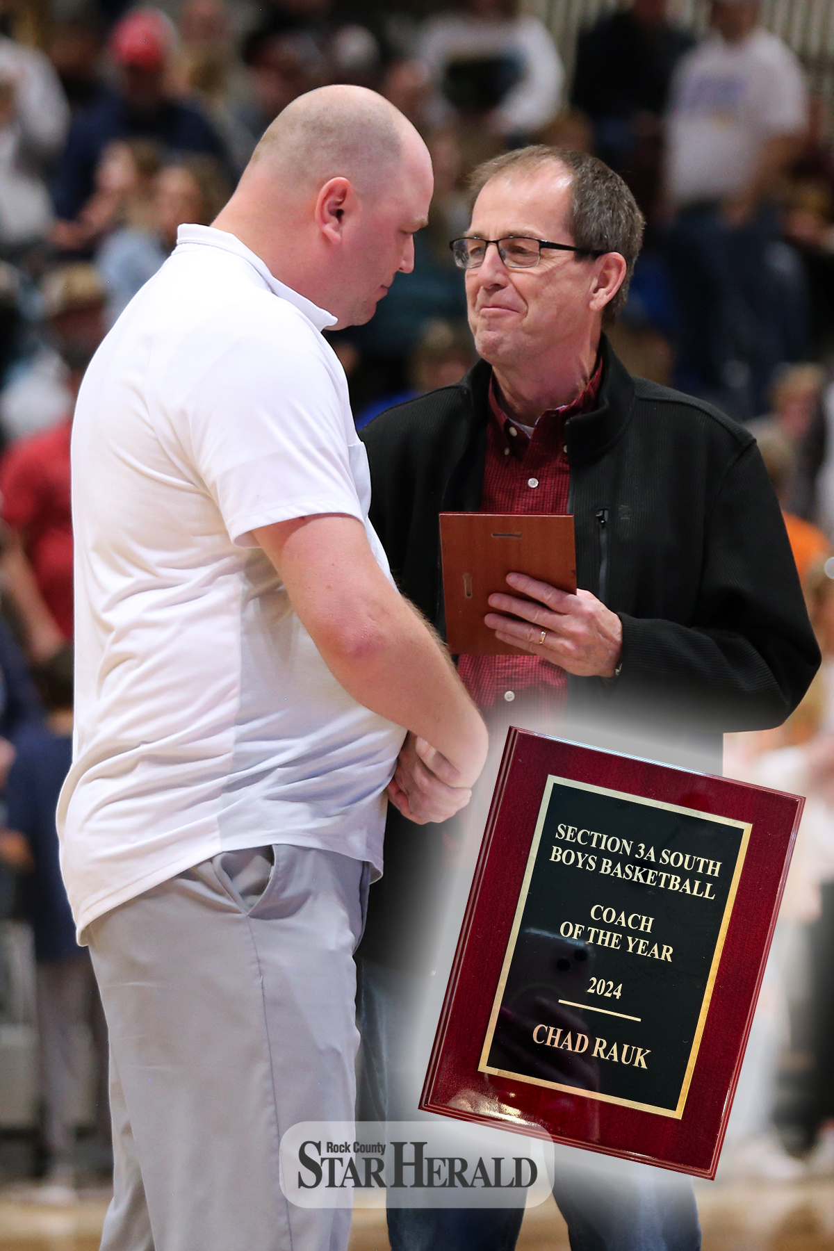 Loren Carlson from the Sub Region 10 Coaches Association, right, presents H-BC boys’ basketball head coach Chad Rauk with the 2024 Section 3A South Coach of the Year plaque after the Section 3 - South Subsection Championship game against Russell-Tyler-Ruthton on March 9 in Marshall.