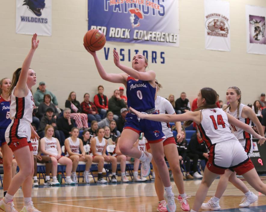 Patriot sophomore Abbie Harris drives the lane against Dell Rapids for a layup Friday, Dec. 29, at home. H-BC won the game against the Cardinals 79-50 during the holiday break.