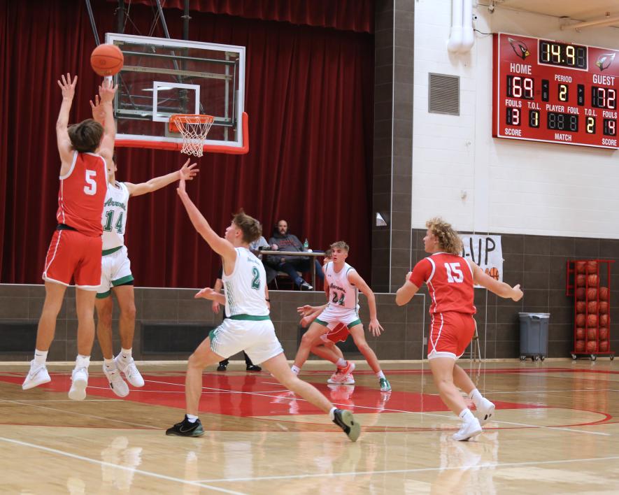 Junior Carter Sehr, No. 5, puts up a three-point shot with seconds left in regulation play against Pipestone. The shot found the net and the game went into overtime. In overtime the Arrows outplayed Luverne to win the game 87-80 Tuesday, Jan. 23, in Luverne.