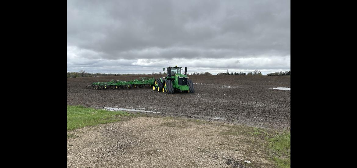 Parked farm machinery like the one in this field west of Luverne is a common scene all over Rock County after much needed rainfall brought a halt to spring planting. Another inch or more fell during Monday night’s storm. Lori Sorenson/Rock County Star Herald Photo