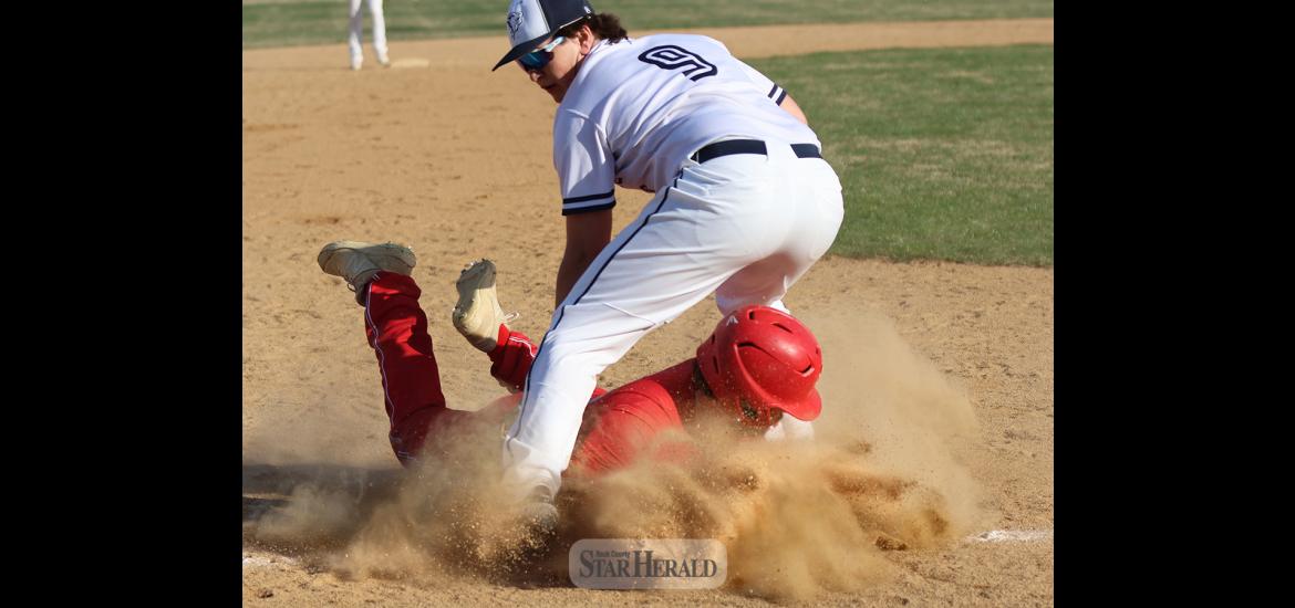 Senior Will Serie safely slides into third base against Jackson at home Tuesday, April 23. Serie had one hit and an RBI in the 10-7 win.