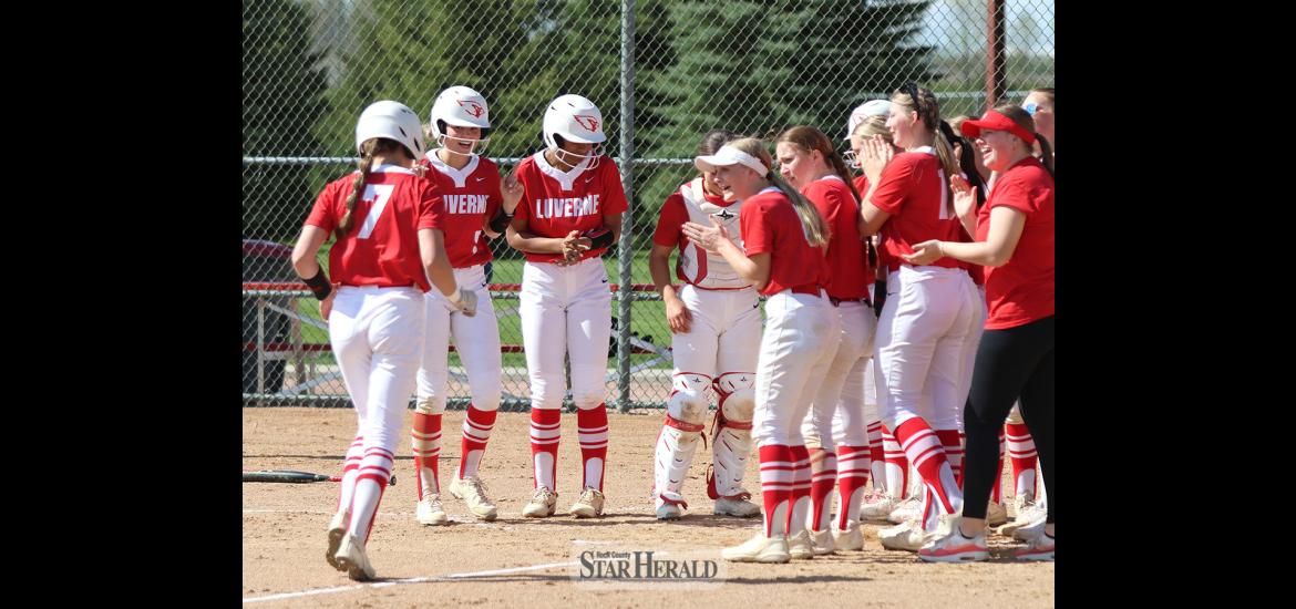 The Luverne softball team surrounds home plate after junior Amira Cowell hit her first home run of the season. It came against Blue Earth in the first game of their Thursday, May 9, doubleheader. 