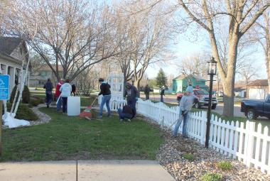 Adults and youth with the Magnolia Juniors 4-H Club gathered Thursday night, April 18, at The Cottage in Luverne where they cleaned the front and back yards. The spring landscape maintenance used to be done by George Bonnema, who died in December. Mavis Fodness/Rock County Star Herald Photo