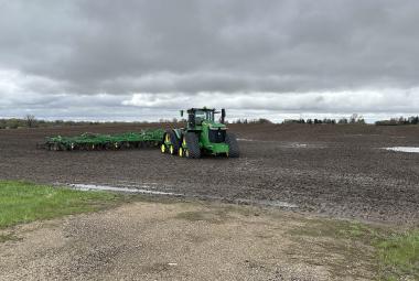 Parked farm machinery like the one in this field west of Luverne is a common scene all over Rock County after much needed rainfall brought a halt to spring planting. Another inch or more fell during Monday night’s storm. Lori Sorenson/Rock County Star Herald Photo