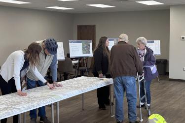 About two dozen people attended the April 23 open house at the East Main Street trailhead building to learn about the Highway 75 construction planned for 2026. Pictured are (from left) MnDOT public engagement coordinator Anne Wolff, resident Claude Van Driel, Mary Loeffler of MnDOT and residents Harold and Toni Van Wyhe. Lori Sorenson/Rock County Star Herald Photo
