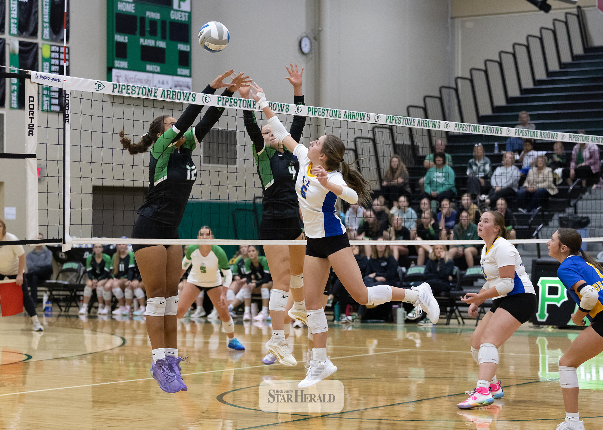 Greg Hoogeveen photo/0917A/EVB1 Adrian-Ellsworth junior Jordan Kruger, No. 6,  extends to hit the ball over the net against Pipestone Sept. 14 on the road. The Dragons beat the Arrows in three sets.