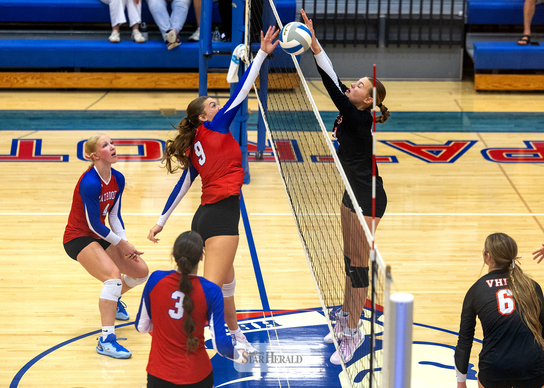Greg Hoogeveen photo/0917HBCVB1 Patriots senior Ava Steinhoff, No. 9, fights for a free ball over the net against Viborg-Hurley Sept. 10 at home. The Patriots beat the Cougars in three straight sets in their first home match.