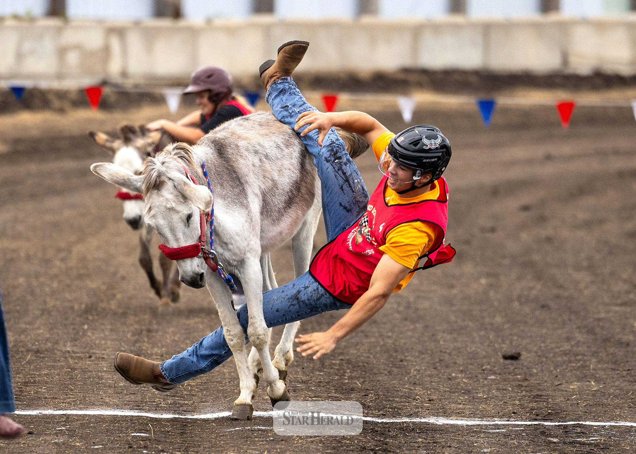 Matthew Gangestad prepares to hit the ground after getting a wild donkey across the finish line July 29.
