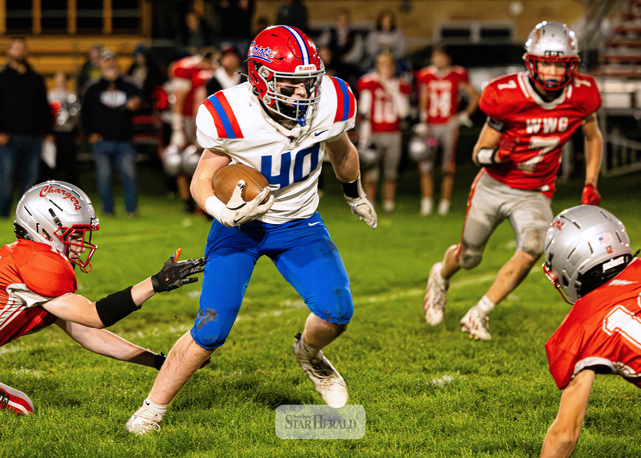 Samantha McGaffee photo/H-BCFB1 H-BC freshman Huck Terry weaves his way through several Chargers players on the road Friday, Sept. 25. H-BC won the game 55-6. Terry rushed for 55 yards and one touchdown.