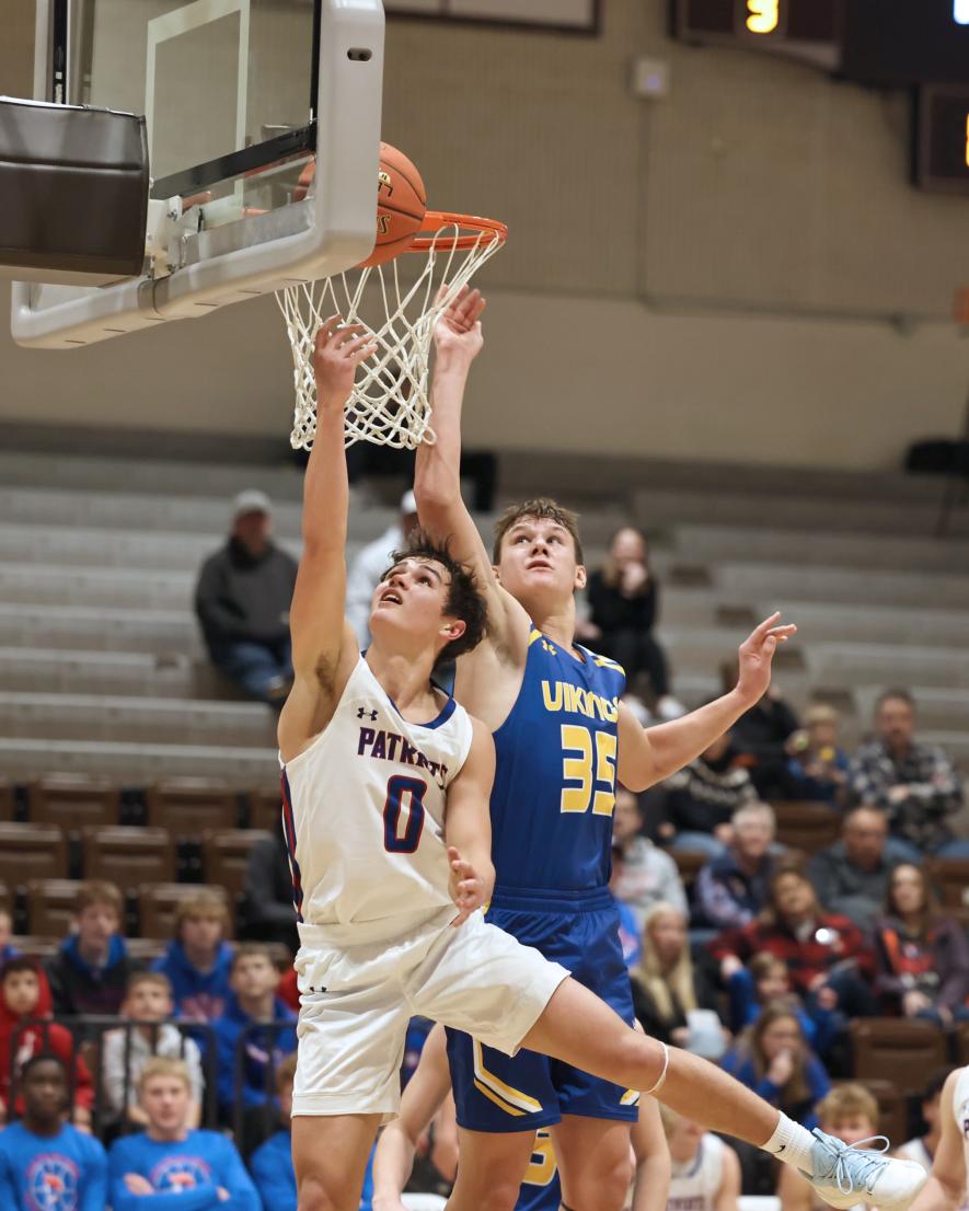 Sophomore Patriot Micah Bush, No. 0, looks for a layup Saturday, Dec. 30, against Minneota. H-BC won the game 71-65.