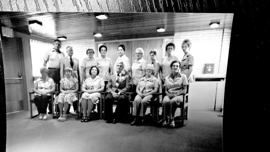 Glenda McGaffee (front, left) was 19 years old when she started working at the Tuff Memorial Home. Pictured in this photo from her early years are (front, from left) Hendrene Leenderts, McGaffee, Maxiene Iverson, Jim Iverson, Ida Halsne, Ana Schouwenberg, (back) Bud Bush, Bill Ehde, Florence Sanstede, Lucy Knobloch, Rozella Metzger, Helga Van Goor, Sandy Leuthold, Malana Boeve and Pearl Hoff. 