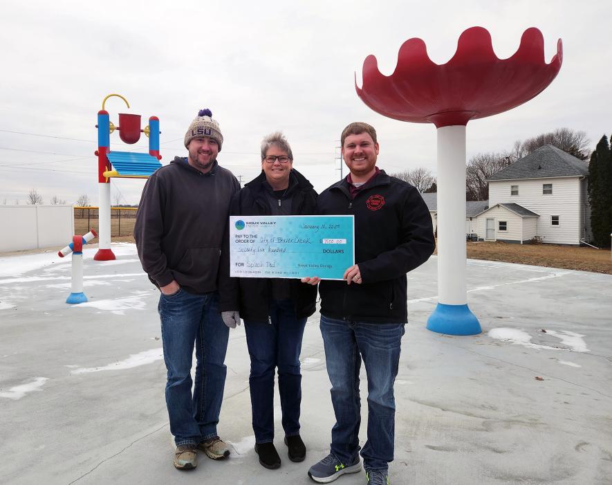 Representatives from the city of Beaver Creek accepted a $7,500 check from Sioux Valley Energy (SVE) Friday morning at the splash park in Beaver Creek. The amount is a combination of $5,000 from SVE Revive 2030 program and $2,500 from SVE Operation Round-Up (See related story). The money will go toward the fundraising campaign to update and expand the Beaver Creek splash pad. Pictured are Beaver Creek public works director Travis Helgeson (left), City Council member Heidi Freese and Mayor Josh Teune. 