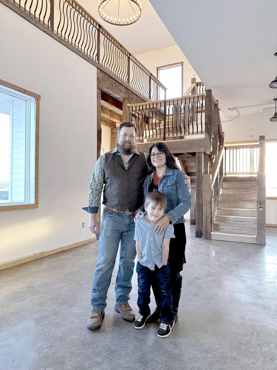Sean McFarland and his wife, Marcella, and son Cedar are pictured in the tasting room of their Cidery at Blackshire Farms in Beaver Creek on Jan. 25. They’ll host an event for the community Saturday, Feb. 1, to show off renovation progress and share cider samples. Lori Sorenson/Rock County Star Herald Photo