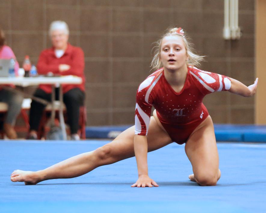 Junior Ella Reisdorfer finishes her floor routine Friday, Jan. 26, in Luverne. Reisdorfer took first place in the event with a new school record of 9.3750. The Cardinals beat the Marshall Tigers 134.950 to 118.7250 in team competition.