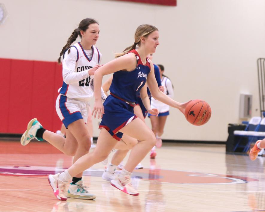 Junior Bailey Spykerboer dribbles past HLOF on her way to the hoop. The Lady Pates beat the Coyotes 51-16 at home Thursday, Feb. 1.