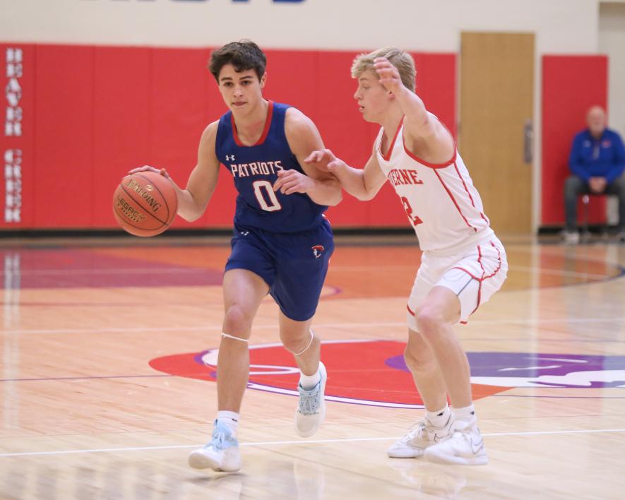 H-BC sophomore Micah Bush pushed the ball up court against LHS sophomore Connor Bose.