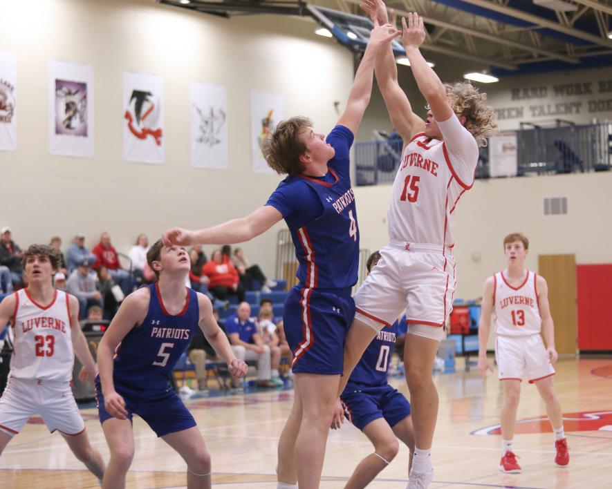 Senior Gavin DeBeer shoots over H-BC Junior Beau Bakken