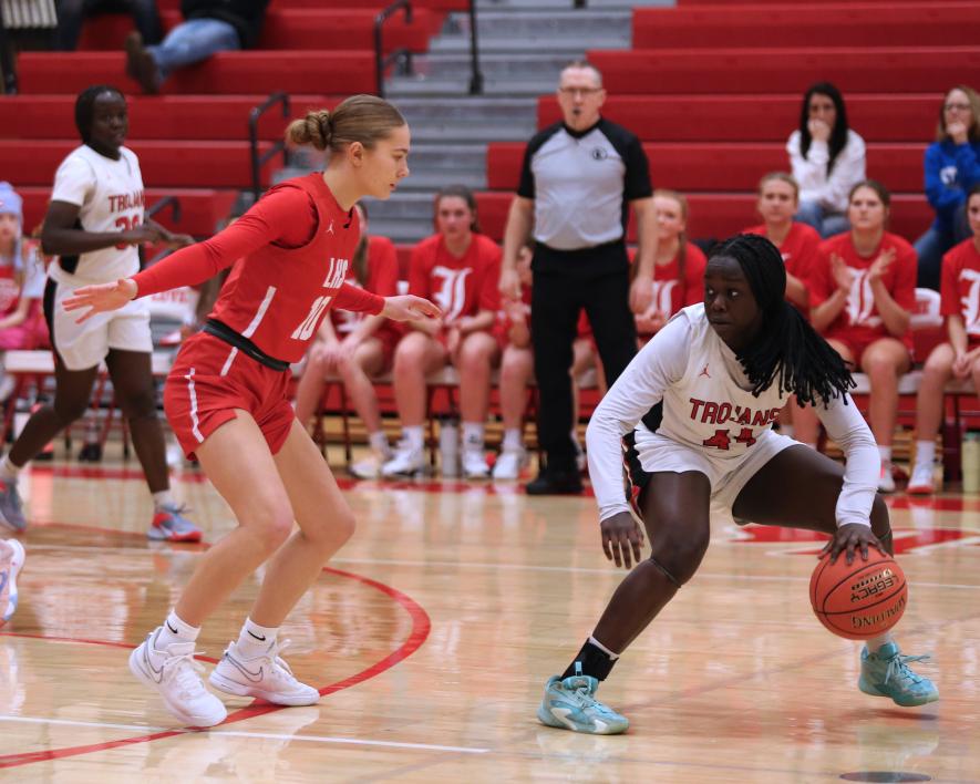 Senior Sarah Stegenga guards a Worthington player who is looking to make a pass Thursday, Feb. 15, in Luverne. The Trojans beat the Cardinals 65-44.