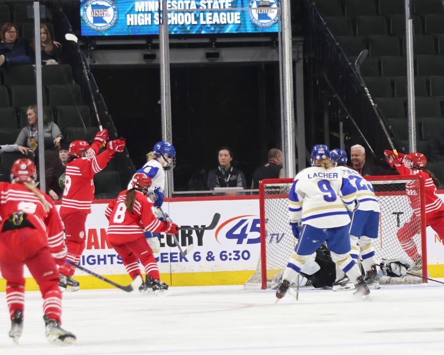 The Luverne girls’ hockey team reacts to a goal scored by sophomore Hannah Woodley in the state quarterfinal game against Academy of Holy Angels Wednesday, Feb. 21. The Cardinals fell 6-1 to the Stars in the game.