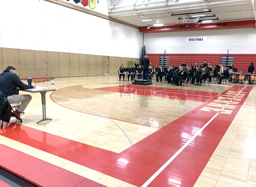 Luverne High School concert band, directed by James Jarvie, plays “The Witch and the Saint” by Steven Reineke for judge John Ginacchio of Marshall (far left) in the high school gymnasium. Other instrumental judges included Mike Peterson, Fulda, and Rick Nicklay, Okoboji, Iowa. Mavis Fodness/Rock County Star Herald Photo