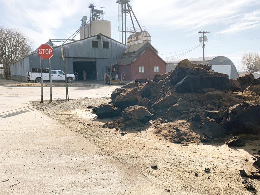 Charred ground turkey byproducts are piled across the street from Magnolia Milling LLC in Magnolia Friday morning, March 14. A fire ignited through “natural combustible elements” prompted a 10:09 p.m. fire call Thursday, March 13, to the Magnolia, Luverne and Adrian fire departments.