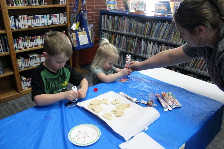 Bentley (left) and Brooklyn Bosch of Ash Creek decorate cookies with mom, Krista.