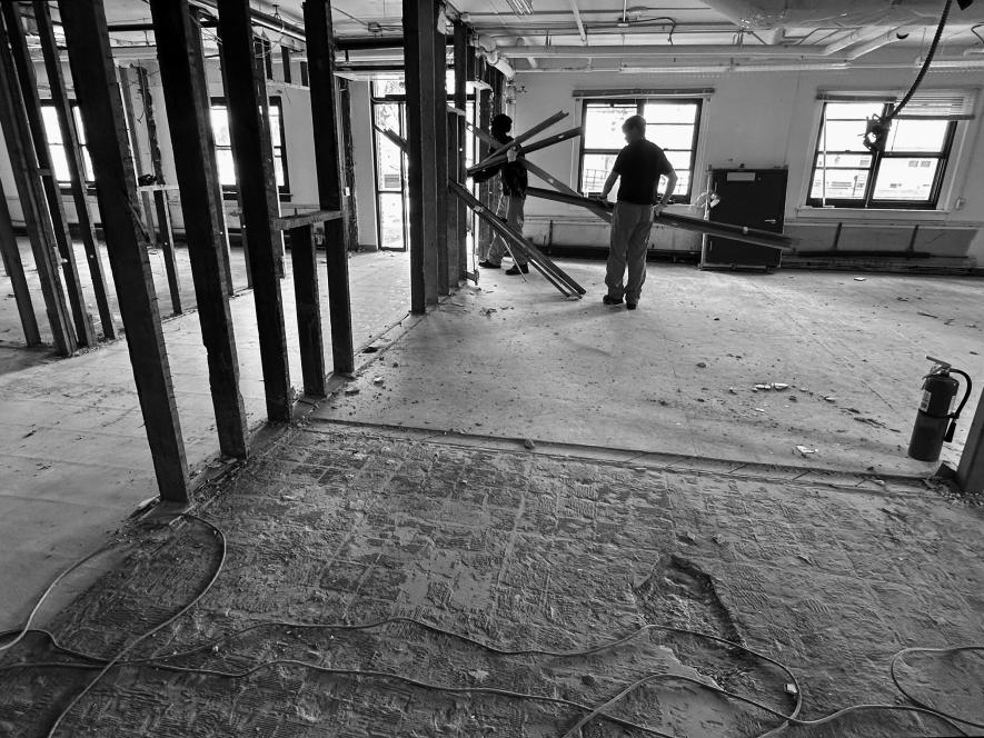 Inmates with Rock Nobles Community Corrections have been working on the former Luverne Armory to get interior rooms ready for the Rock County Land Management Office. Here they are removing tin, wiring and lighting fixtures. Lori Sorenson/Rock County Star Herald Photo