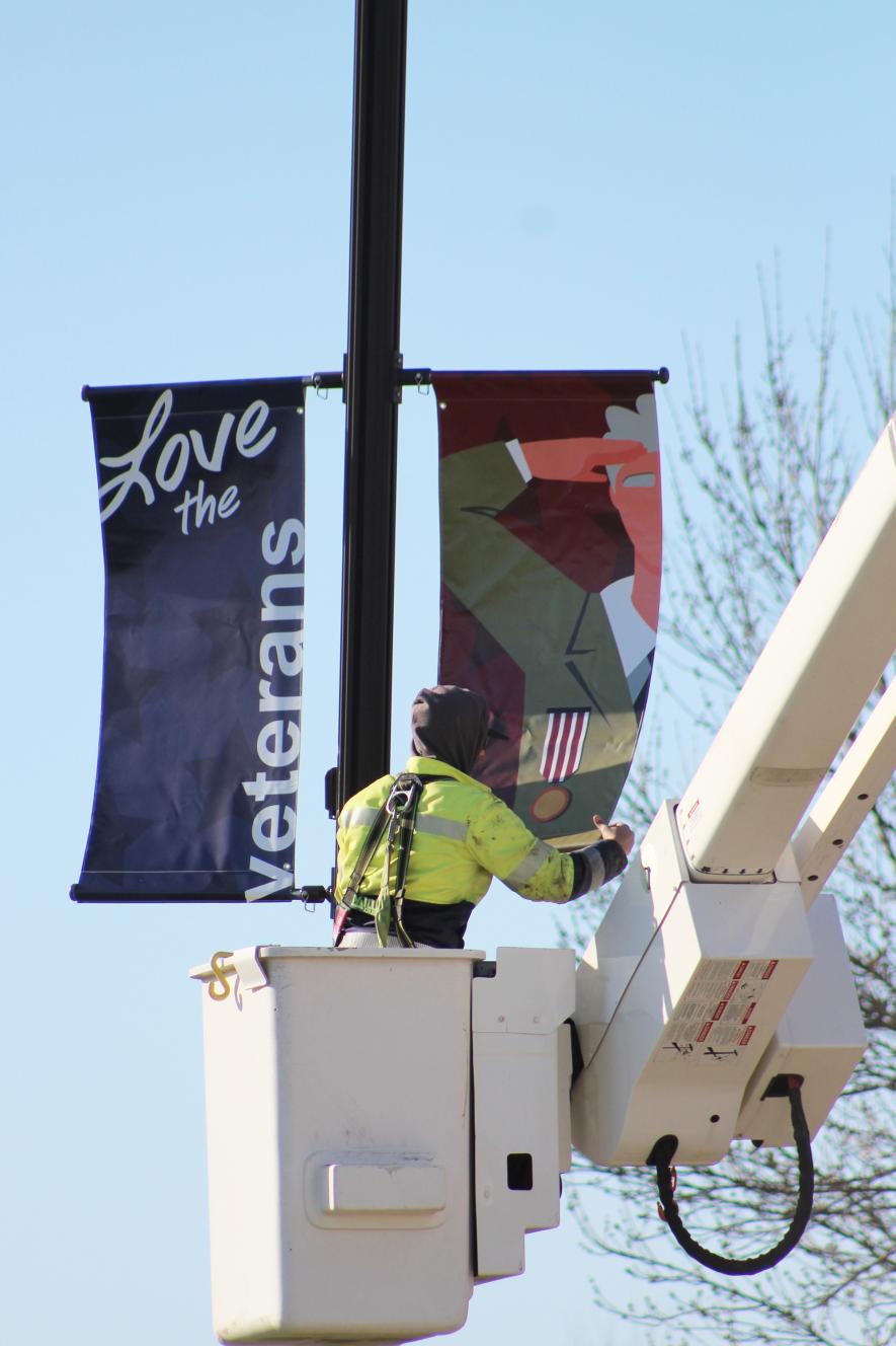 Braydon Ripka secures the new banner into place. Mavis Fodness/Rock County Star Herald Photo