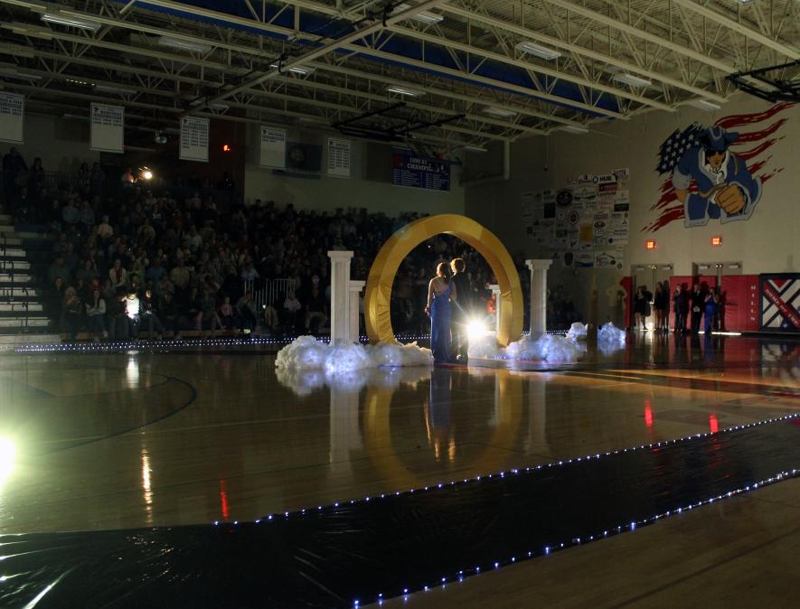 Larissa Steinhoff and Quintice Susie stand under the arch Friday night during the Hills-Beaver Creek High School grand march. Mavis Fodness/Rock County Star Herald Photo