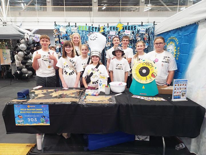 Hills-Beaver Creek robotics team (from left) Ryker Gehrke, Lily Fick, Penni Moore, Eva Hubbard, Arya Tollefson, Bentley Cleveland, Noah Engelkes, Ian Lingen, Elaina Bos and Nora Tatge pose at the team’s “pit” during the WPI Annual First LEGO League event June 13-15 in Worchester, Massachusetts. Shared image