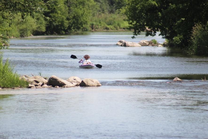 Angi Peterson of Slayton paddles down the Rock River Saturday as part of the inaugural “Ride the Rock.” Peterson was the first to arrive at the Luverne City Park bridge. Mavis Fodness/Rock County Star Herald Photo