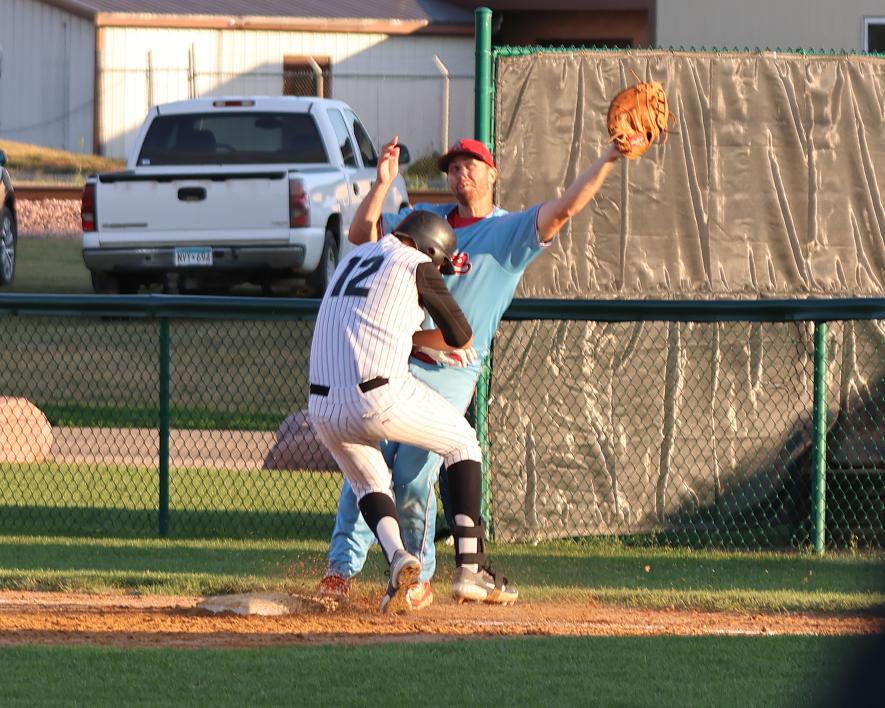 Redbird first basemen Newt Johnson and Hadley runner collide at first base. Runner was called out.