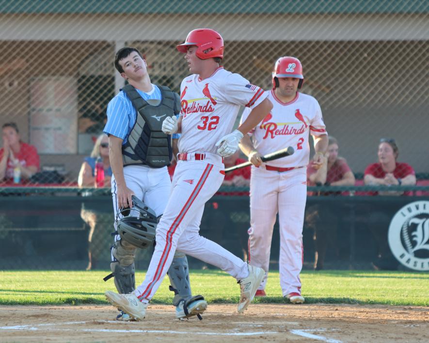 Ben Serie crosses home plate in the third inning against the Tea Storm. The Storm catcher’s face says it all. Luverne won the game 16-3 July 19.