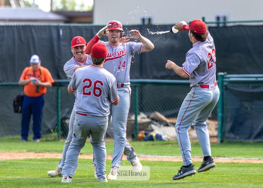 Greg Hoogeveen photos/Redbirds1 Redbirds players run onto the field to celebrate after beating Jackson 12-2 in final game of the third place series. Ethan Beyer, No. 24, drove in the final run to seal Luverne’s spot in the 2026 MBA State Tournament. 