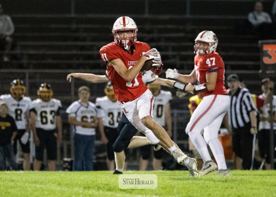 Greg Hoogeveen photo/0917LHSFB1 Cardinals junior Jaxon Pick, No. 11, looks for defenders after making a catch in the middle of the field. Pick took the ball to the house. Luverne beat Sibley East 55-6 at home.