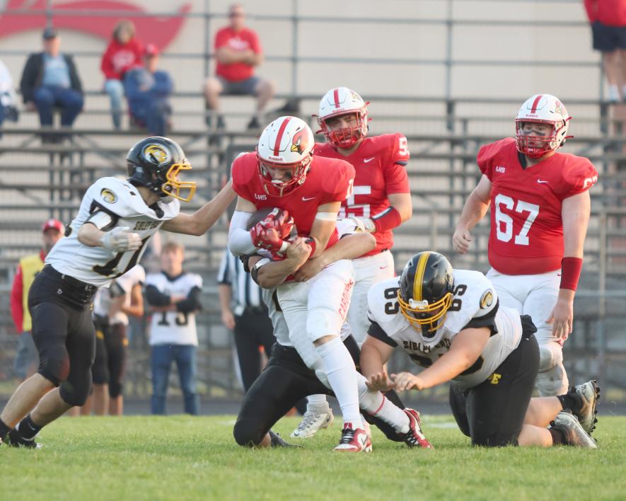 Senior Elliot Domagala carries the ball against Sibley East defense Friday, Sept. 15, in Luverne. Domagala rushed for 55 yards against the Wolverines in the Cardinals’ 35-0 win at home.
