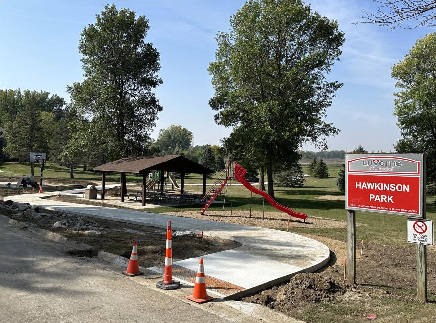 A 10-foot-wide concrete sidewalk goes through Hawkinson Park between Cottage Grove Avenue and the Loop Trail.