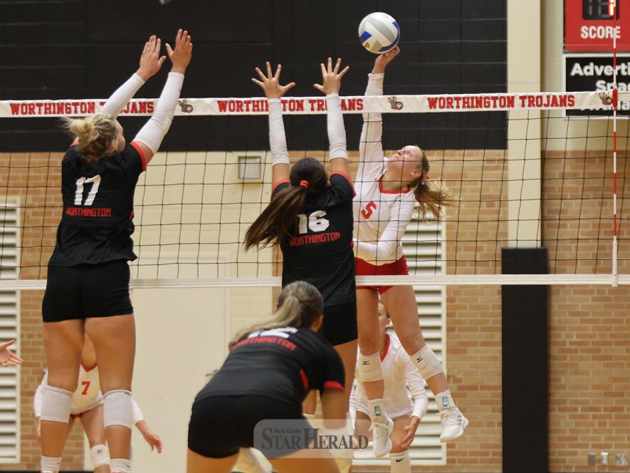 Senior Ella Reisdorfer reaches to spike the ball back to Worthington Thursday, Sept. 19, on the road. LHS fell 3-1 in the meet.