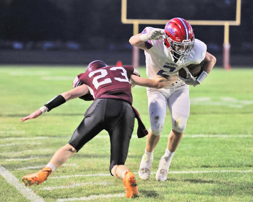  Junior Sawyer Bosch breaks a tackle along the sideline against Mountain Lake Friday, Sept. 22, in the Patriots’ 26-21 win over the Wolverines. H-BC now stands at 4-0 on the season. Samantha McGaffee photo. 