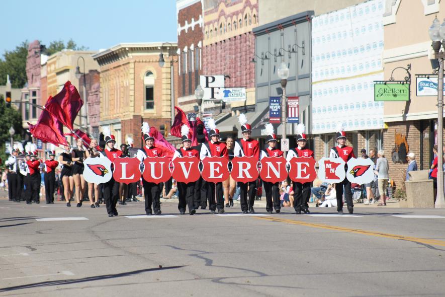 Luverne High School, as hosts and final band in the 74th Tri-State Band Festival, marched in exhibition Saturday morning as 12 marching bands were judged on Main Street. Carrying the sign for the band are (from left) Lydia Jarchow, Cameryn Schepel, Charlotte Bierman, Lucas Brockberg, Lucas Hoffman, Alayna Oechsle, Cooper Thone and Justin Mulder. Mavis Fodness/Rock County Star Herald Photo