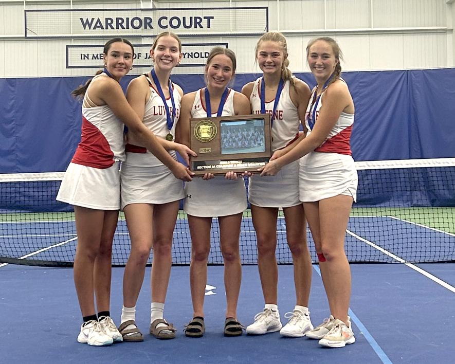 Greg Hoogeveen photo/1012 lhs tennis Seniors Roselynn Hartshorn (left), Cassi Chesley, Morgan Hadler, Sarah Stegenga and Rayann Remme hold their     Section 3A team trophy after beating MacCray and Montevideo Monday, Oct. 9, in Sioux Falls in section playoff games.