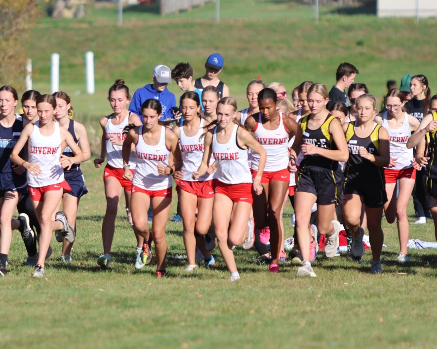 The LHS girls’ 5,000-meter runners take off in Adrian Tuesday, Oct. 10. The Cardinals took the top three finishes in the race. Senior Jenna DeBates was first, seventh-grader Summer Mollberg finished second, and sophomore Ella Schmuck took third place.