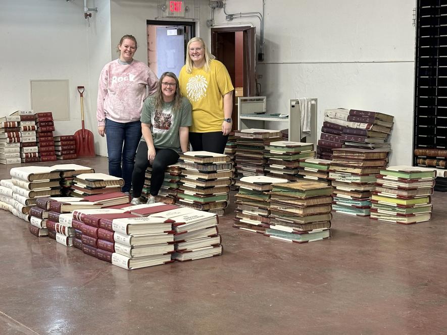 Land Records staff Rachel Jacobs (front), Haley Boltjes (left) and Katie Van Grootheest moved more than 400 books to the armory last week. Lori Sorenson/Rock County Star Herald Photo