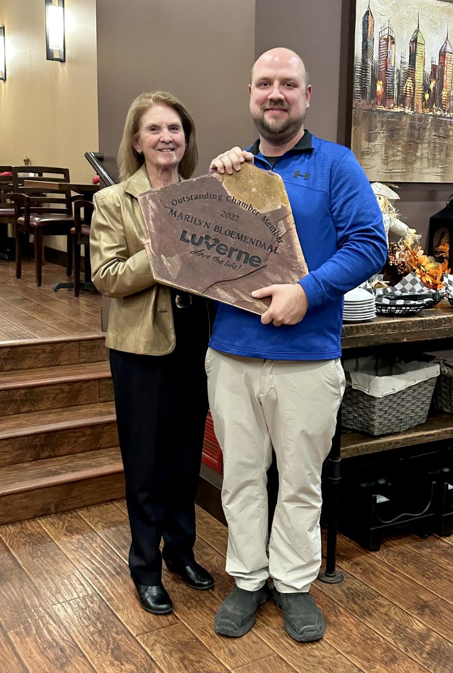 Chamber Board President Tony Schomacker (right) presents Marilyn Bloemendaal with a Sioux quartzite rock etched with her honor, “Chamber Member of the Year,” during Monday night’s reception in Sterling’s Grille and Restaurant. Lori Sorenson/Rock County Star Herald Photo