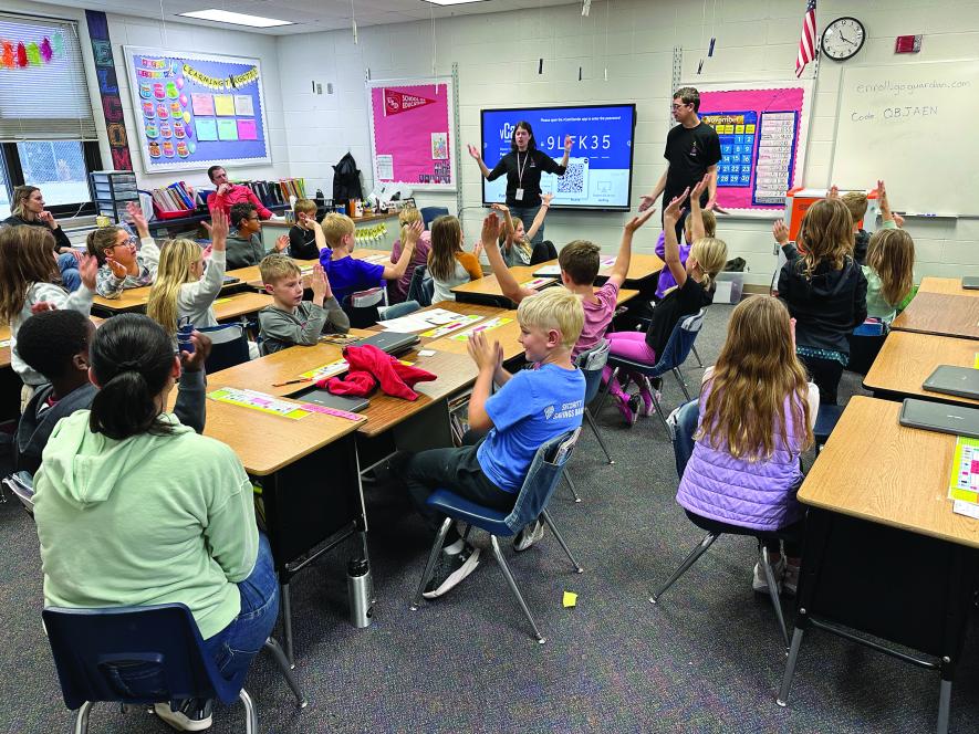 CLIMB Theatre actors Kirsten Erickson and Jon Haven lead third-grade students in Halden Van Wyhe’s classroom in an exercise to define brain health. Pointing at their heads first, they say, “Brain health is how the brain affects how we think, feel and act.” 