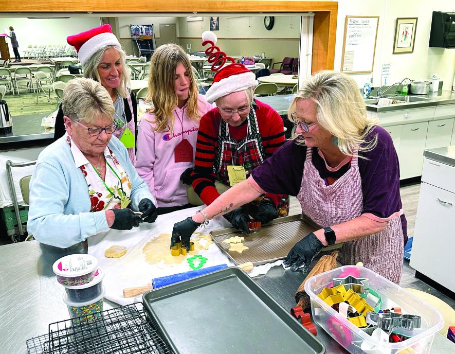 During the “Declutter Retreat” Saturday Jan Israelson, (from left) Brenda Wessels, Amara Antoine, Marlene Wassenaar and Staci Zwaan cut out cookies to prepare for decorating.Lori Sorenson/Rock County Star Herald Photo