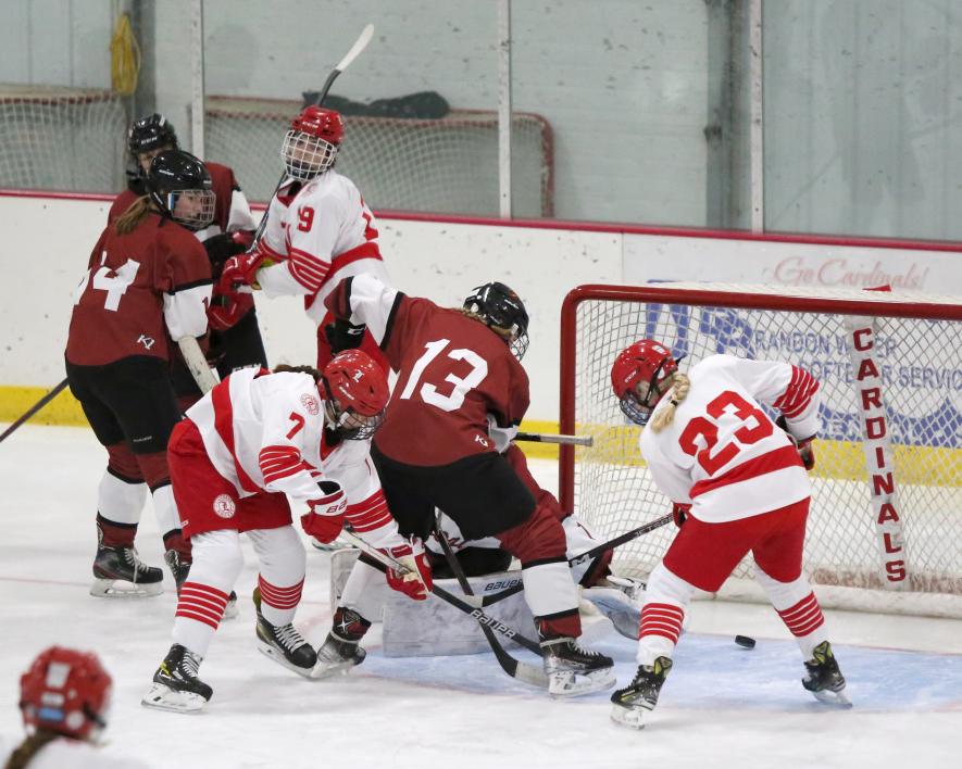 LHS girls’ hockey players, freshman Paula Martinez (No. 7), freshman Trinley Vanderburg (No. 23) and freshman Hannah Woodley (No. 19), pressure the Fairmont goalie Tuesday, Nov. 21, in Luverne. Martinez poked the puck in past the goalie for a goal to help Luverne win 7-1 over Fairmont.