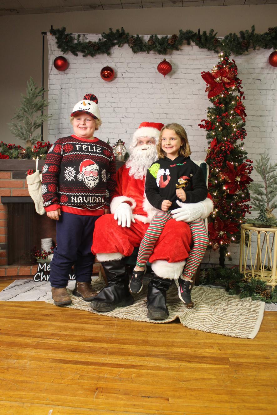 Striking a happy pose with Santa are Remington (left) and Talia Seachris. Mavis Fodness/Rock County Star Herald Photo