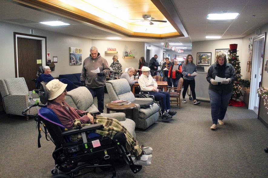 Carolers circle Veterans Home residents in Luverne in each wing, singing from a list of popular holiday songs. Mavis Fodness/Rock County Star Herald Photo