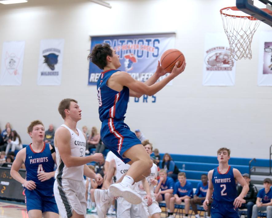 H-BC sophomore Micah Bush leaves the floor to make an easy lay-up against HLOF Thursday, Dec. 7, at home.  The Patriots beat the Coyotes 79-55 for their second win in two games.